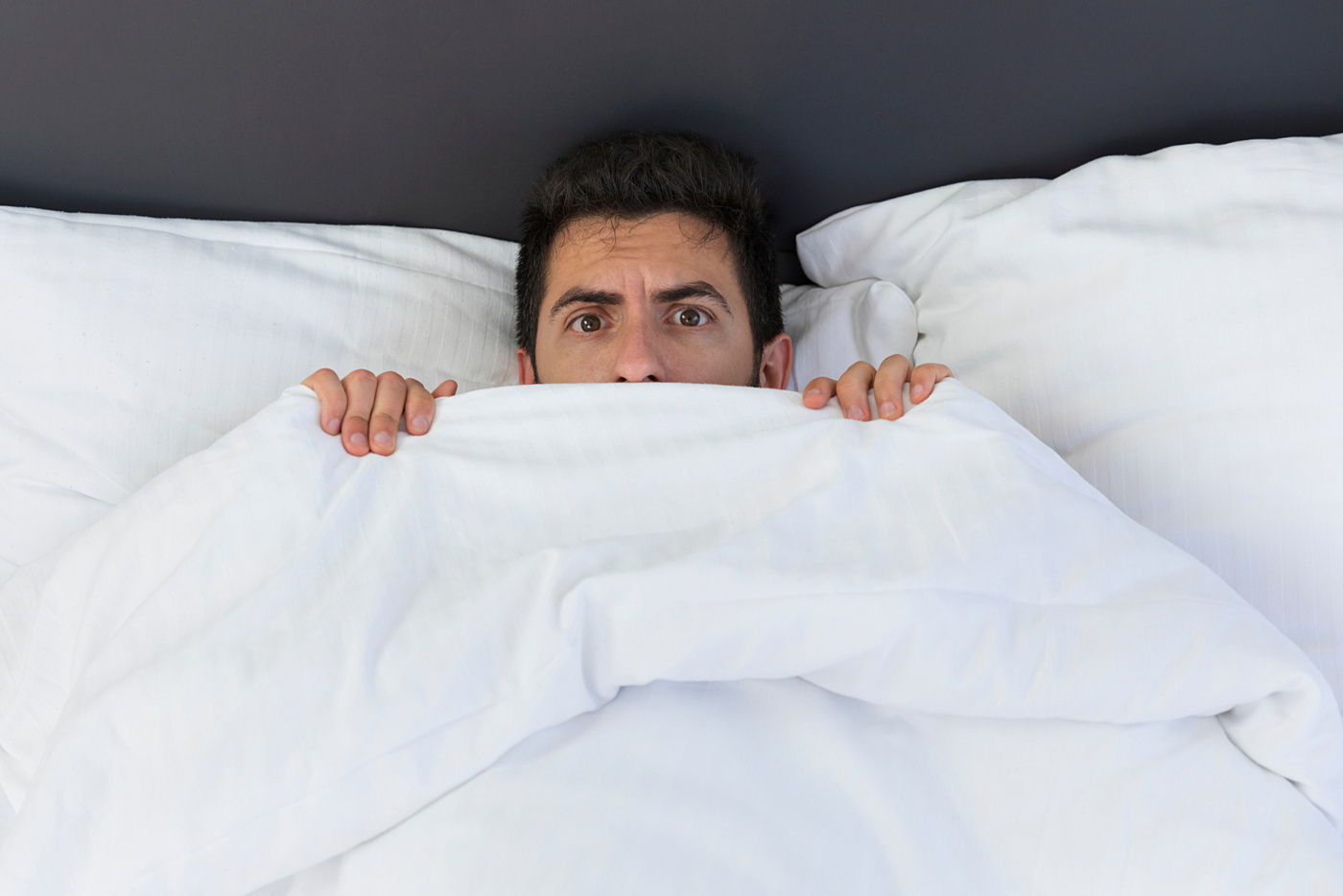 Shutterstock hiding under covers