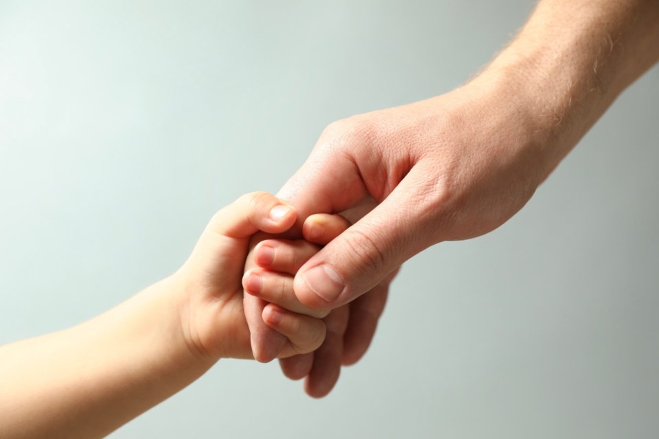 Shutterstock holding child hand